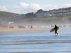 Surfers at Penhale sands Cornwall